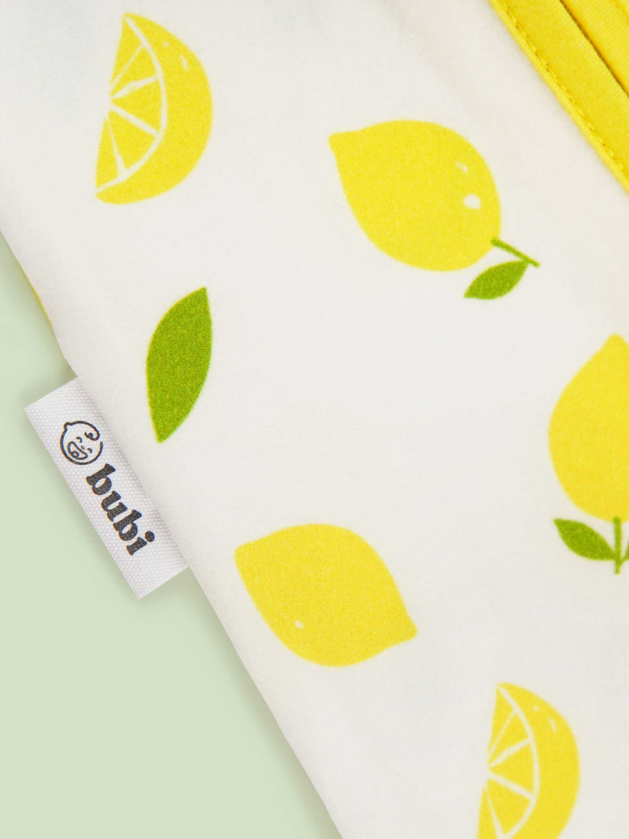 organic cotton baby coverall romper lemons - close-up logo view
