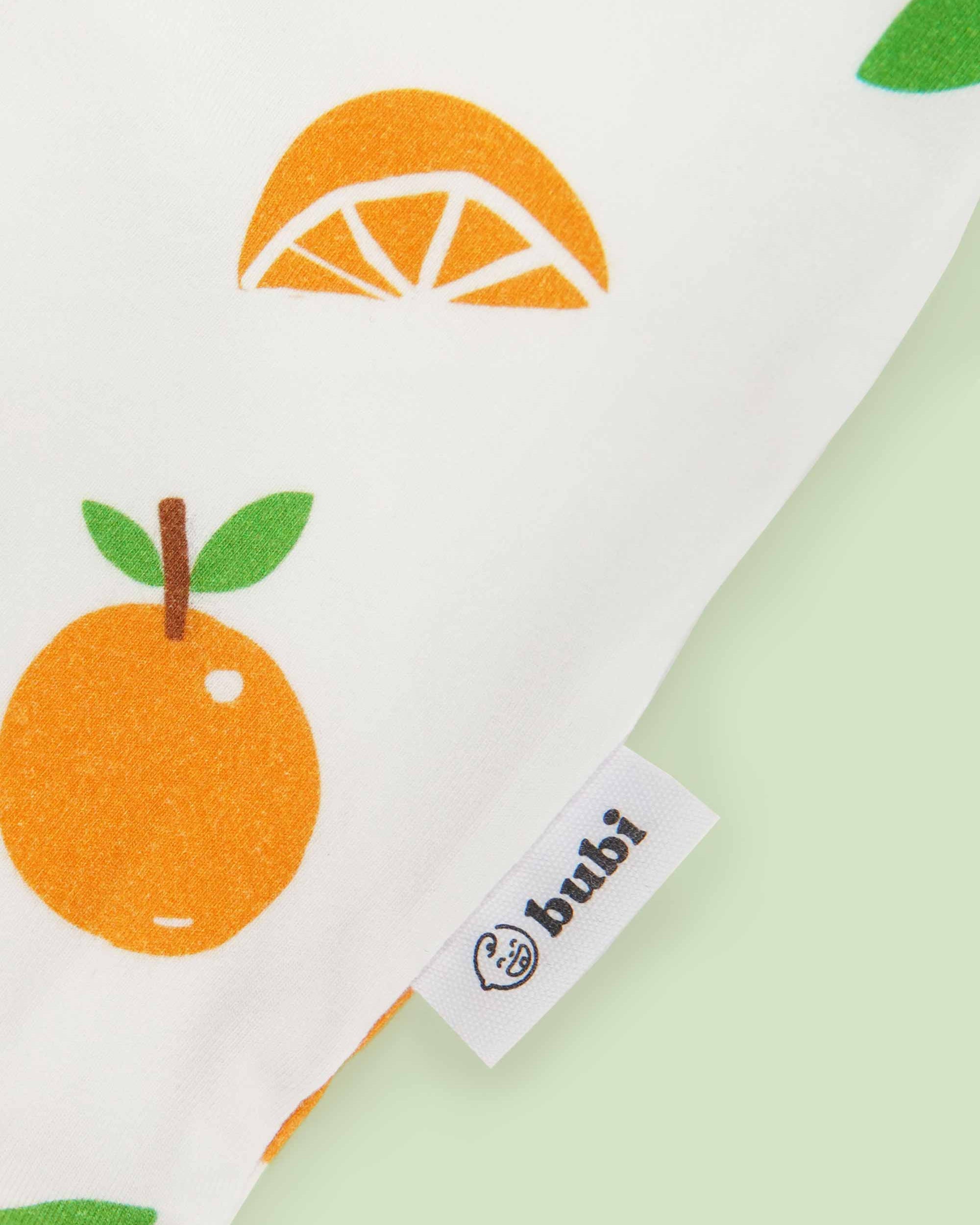 organic cotton baby coverall romper mandarin - close-up logo view