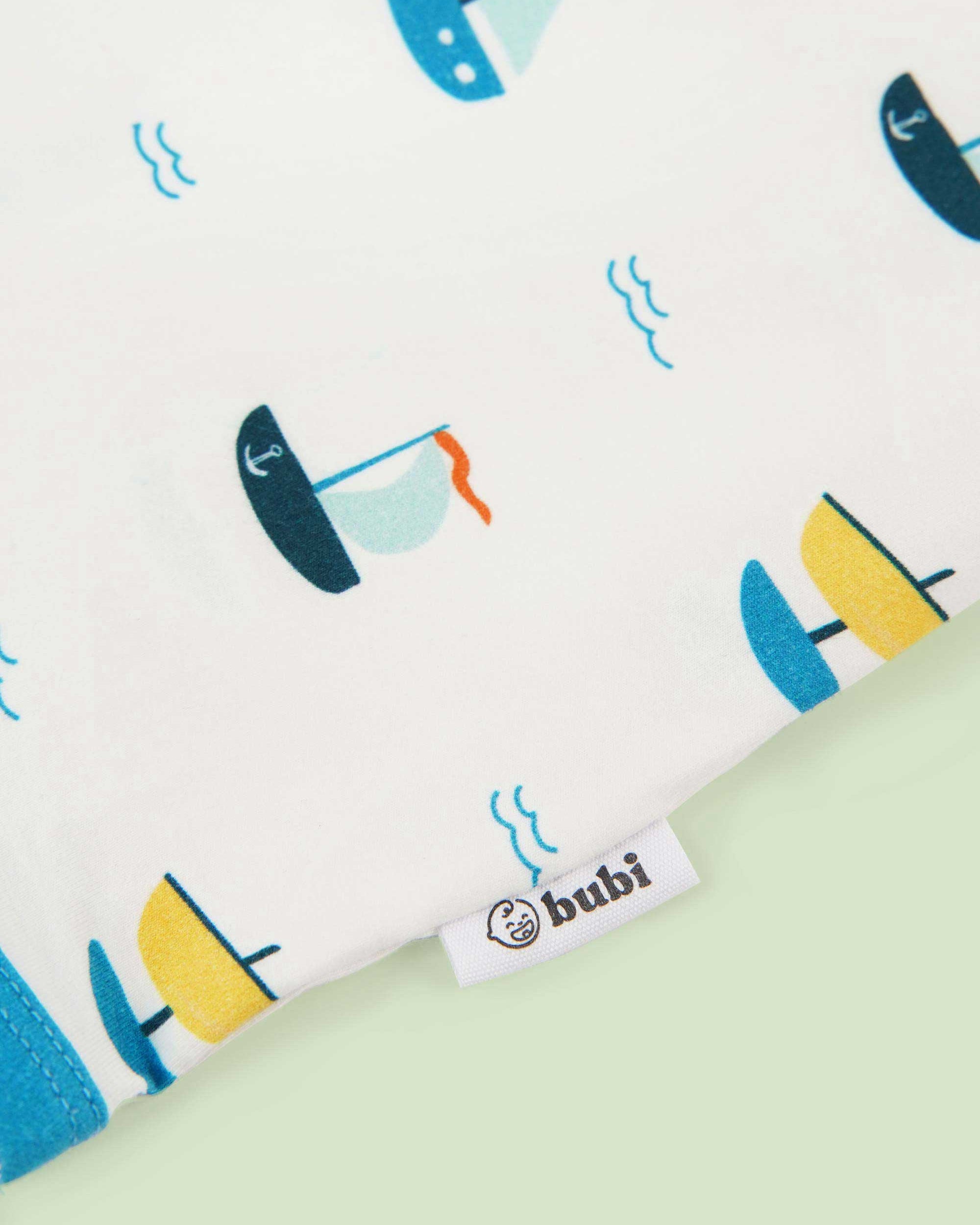 organic cotton baby coverall romper ships - close-up logo view