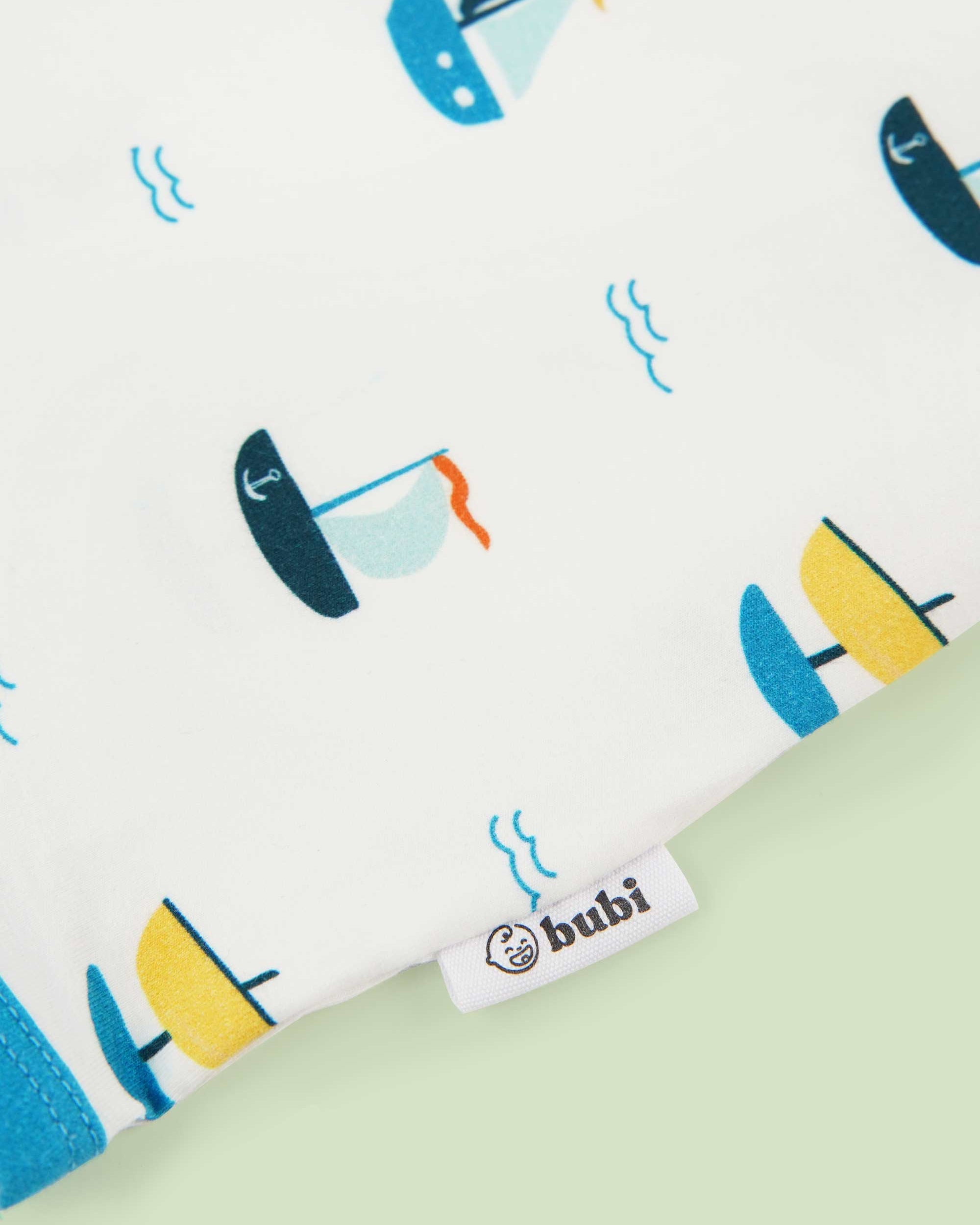 organic cotton bodysuit ships - close-up logo view