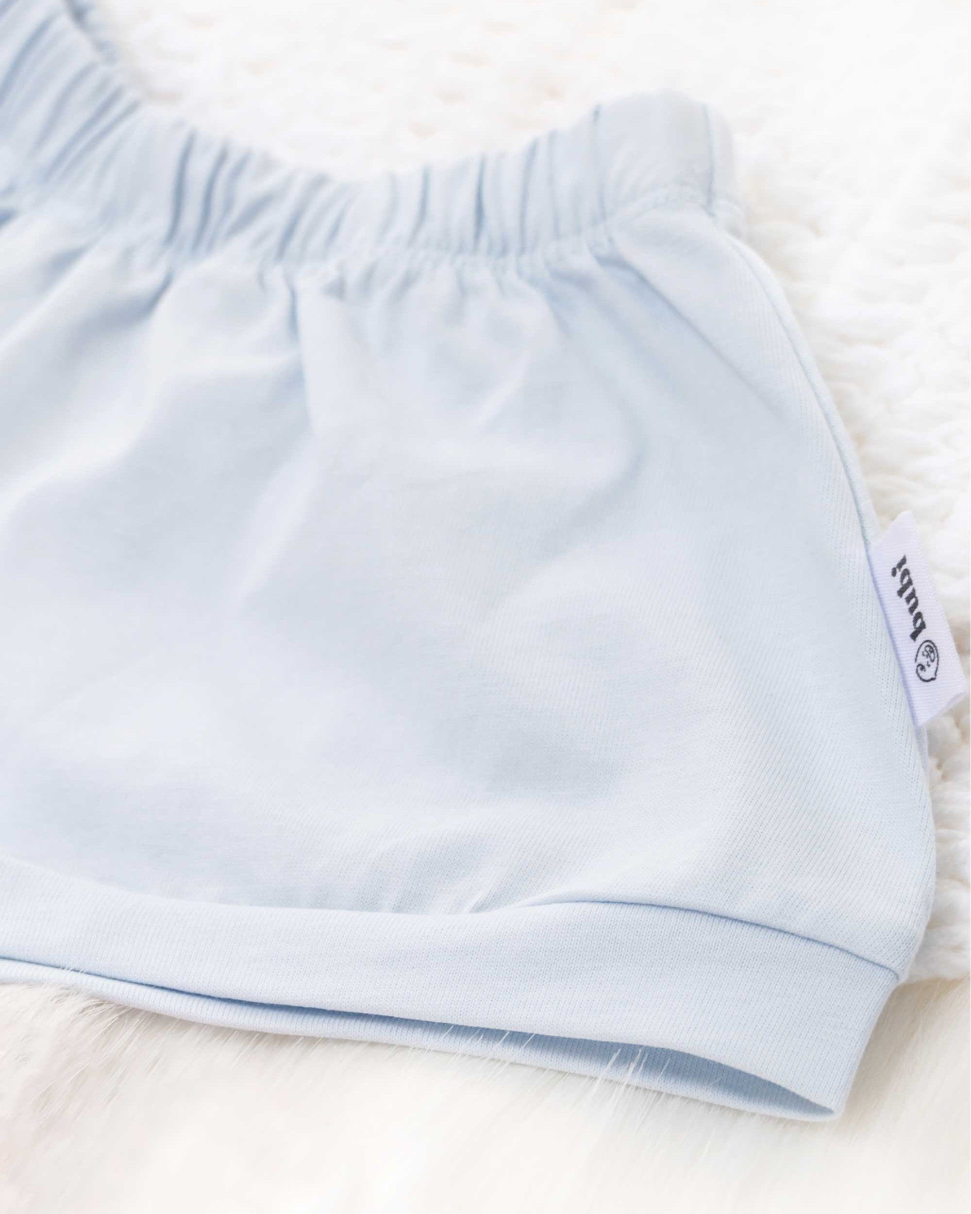 organic cotton baby shorts in blue- side view