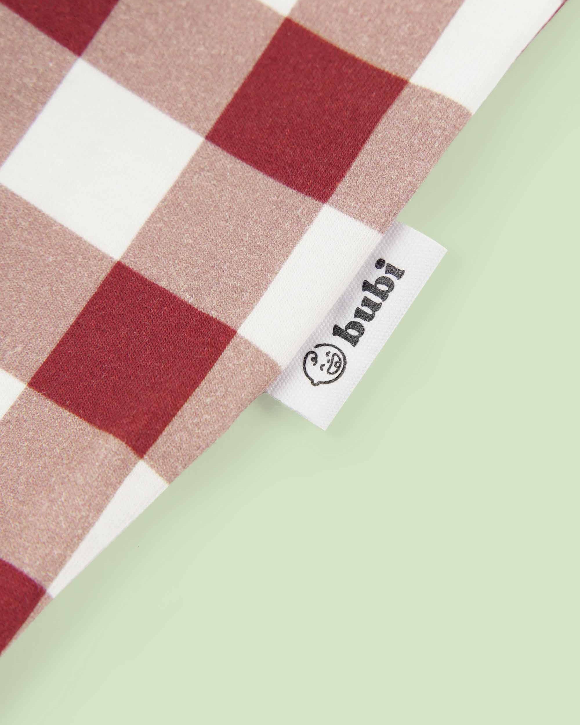 bamboo coverall romper squares pattern - close-up logo view