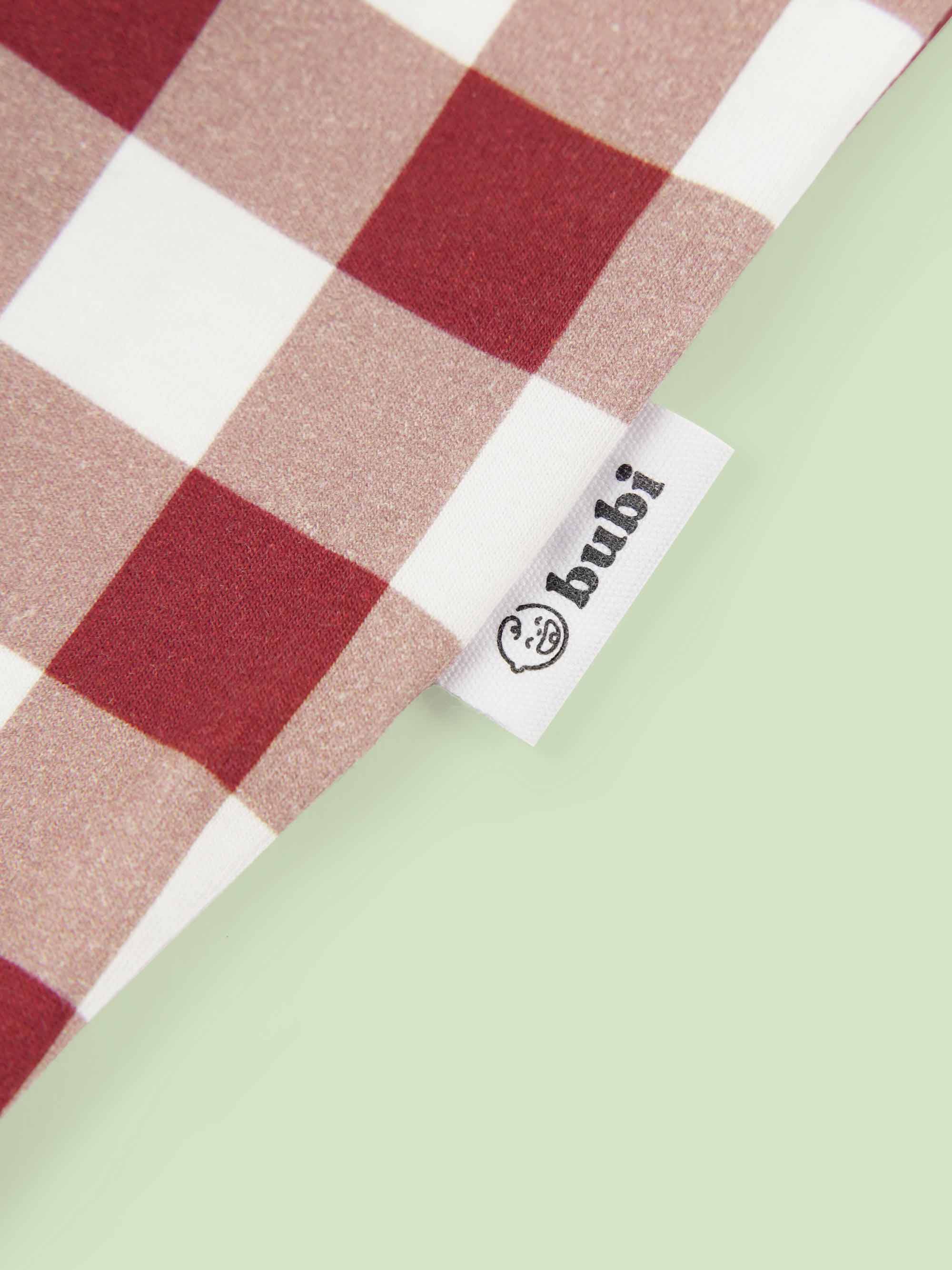 bamboo coverall romper squares pattern - close-up logo view