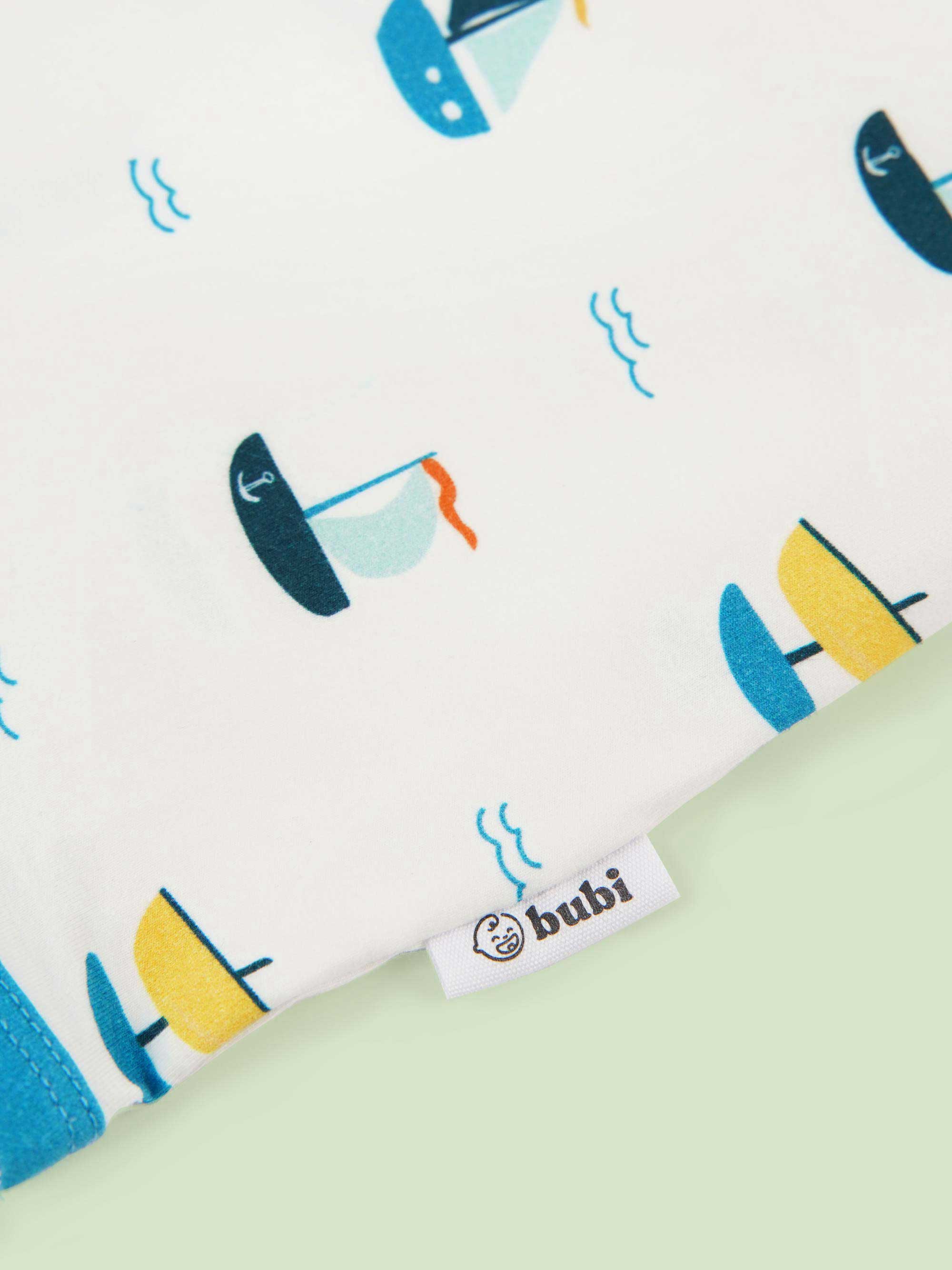 organic cotton baby coverall romper ships - close-up logo view