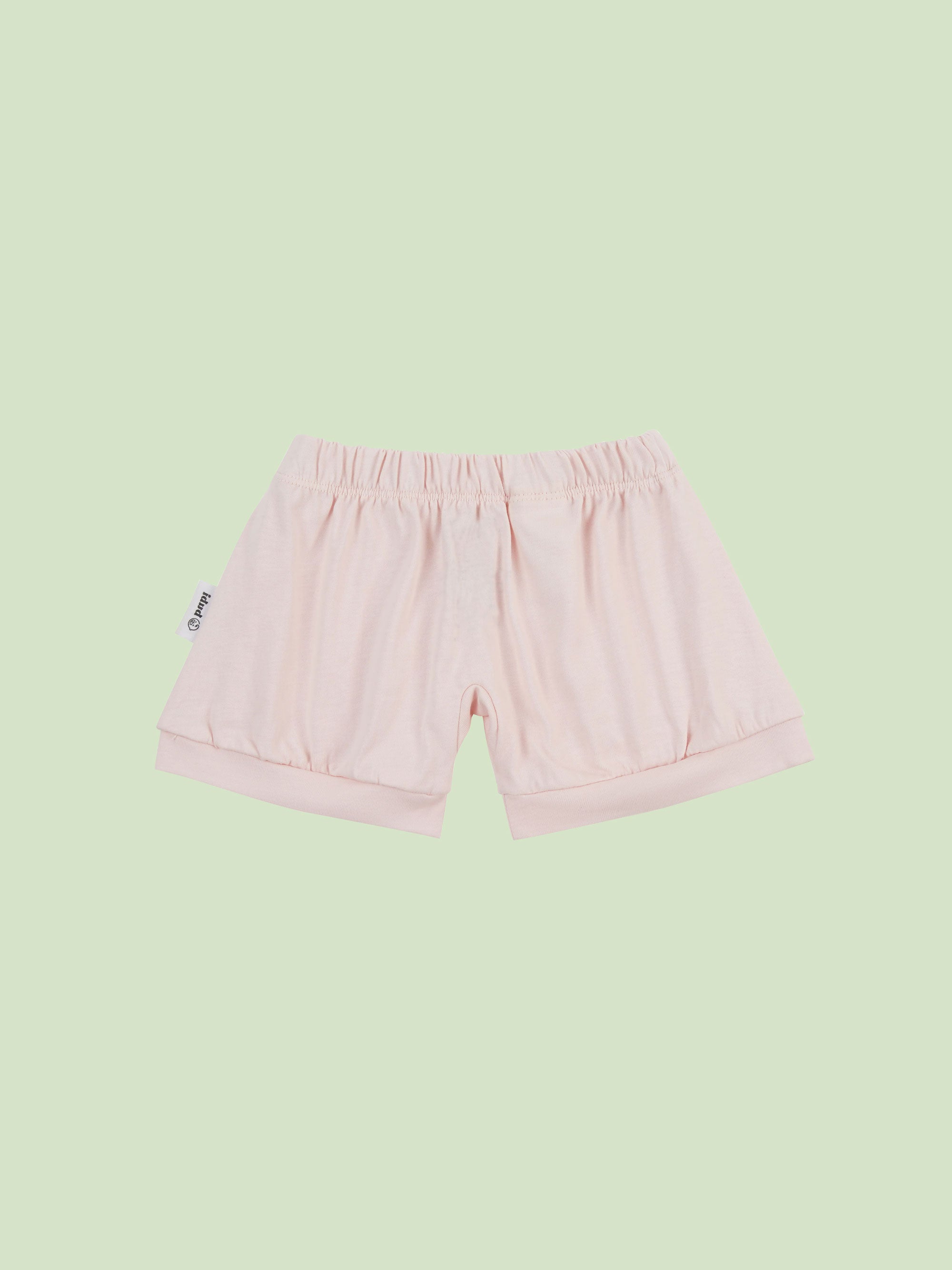 organic cotton baby shorts in pink - front view