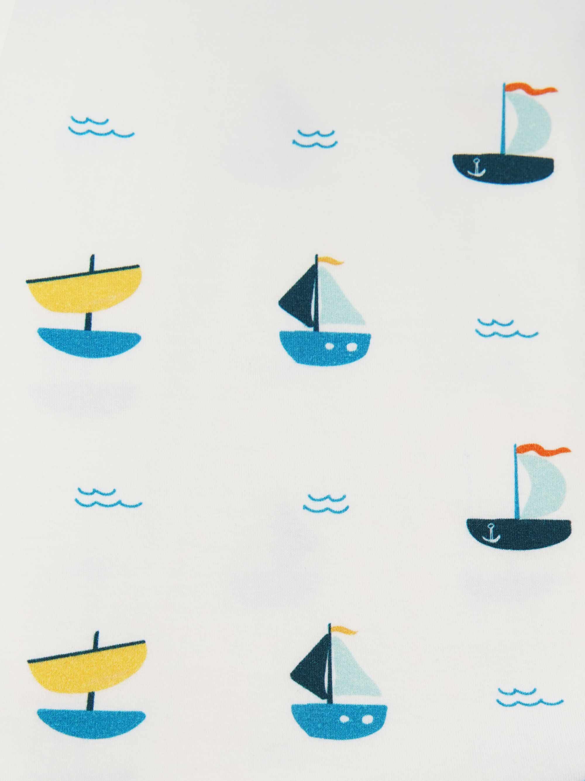 organic cotton bodysuit ships - close-up view