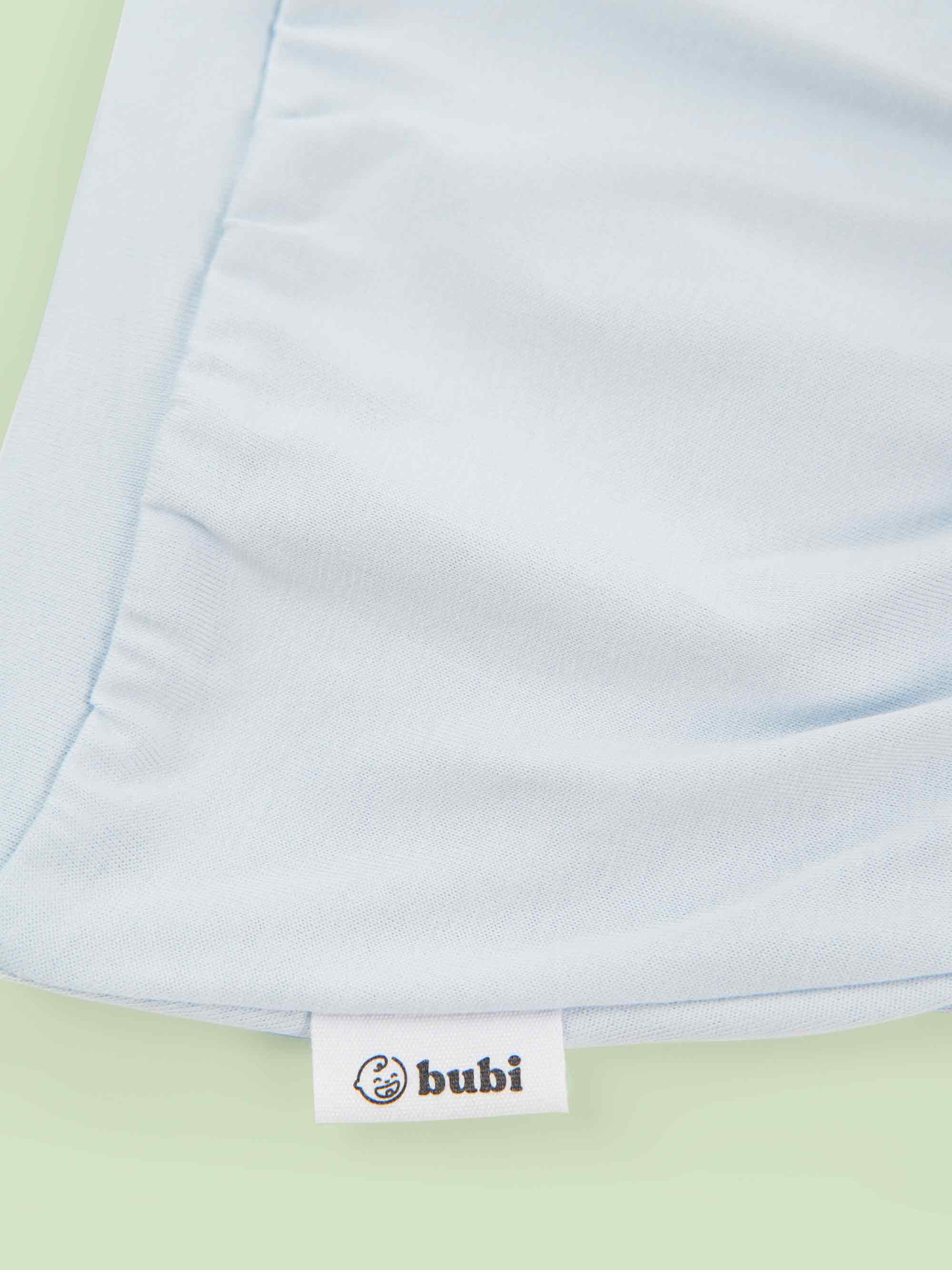 organic cotton baby shorts in blue - flat lay