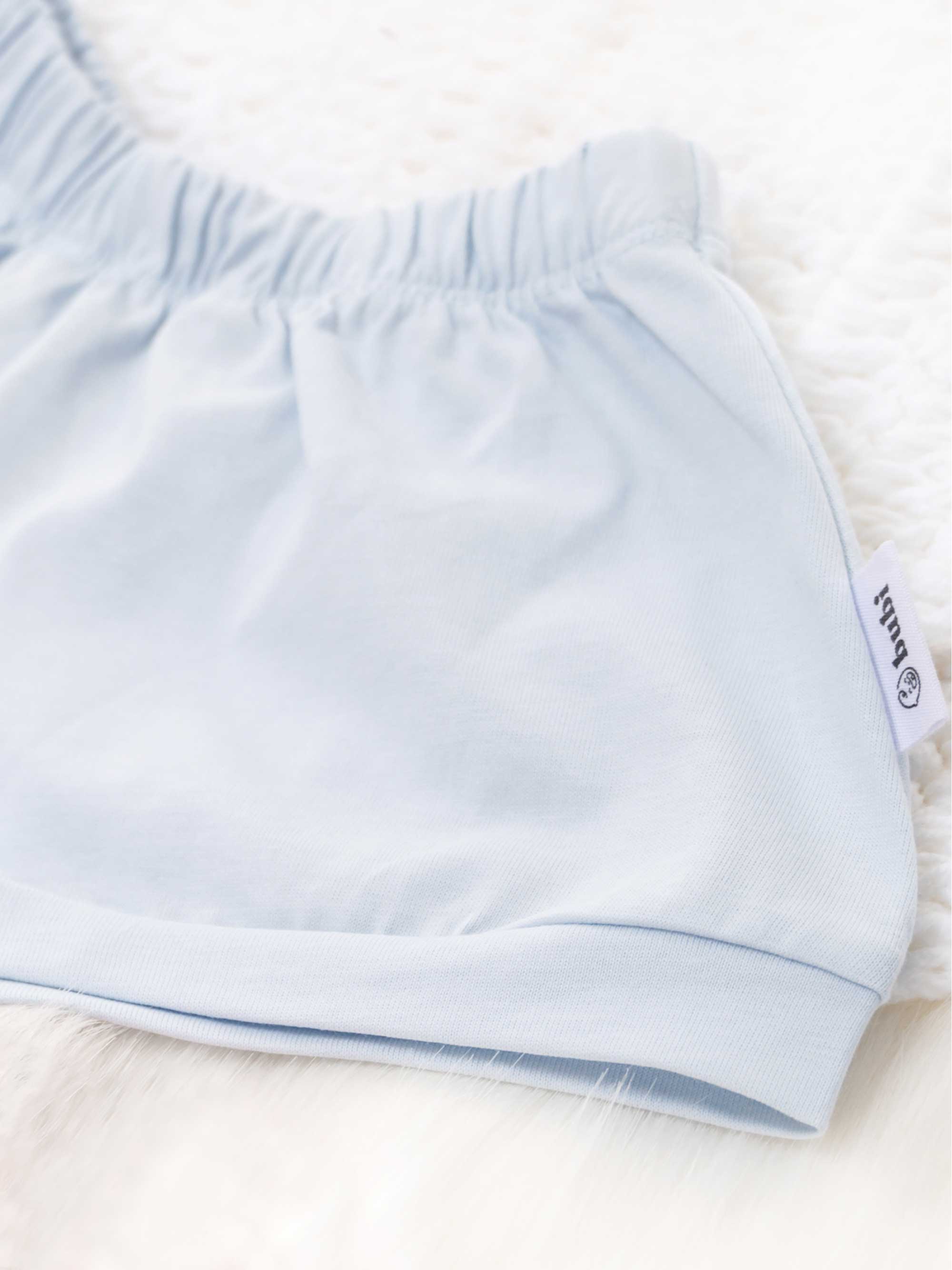 organic cotton baby shorts in blue- side view