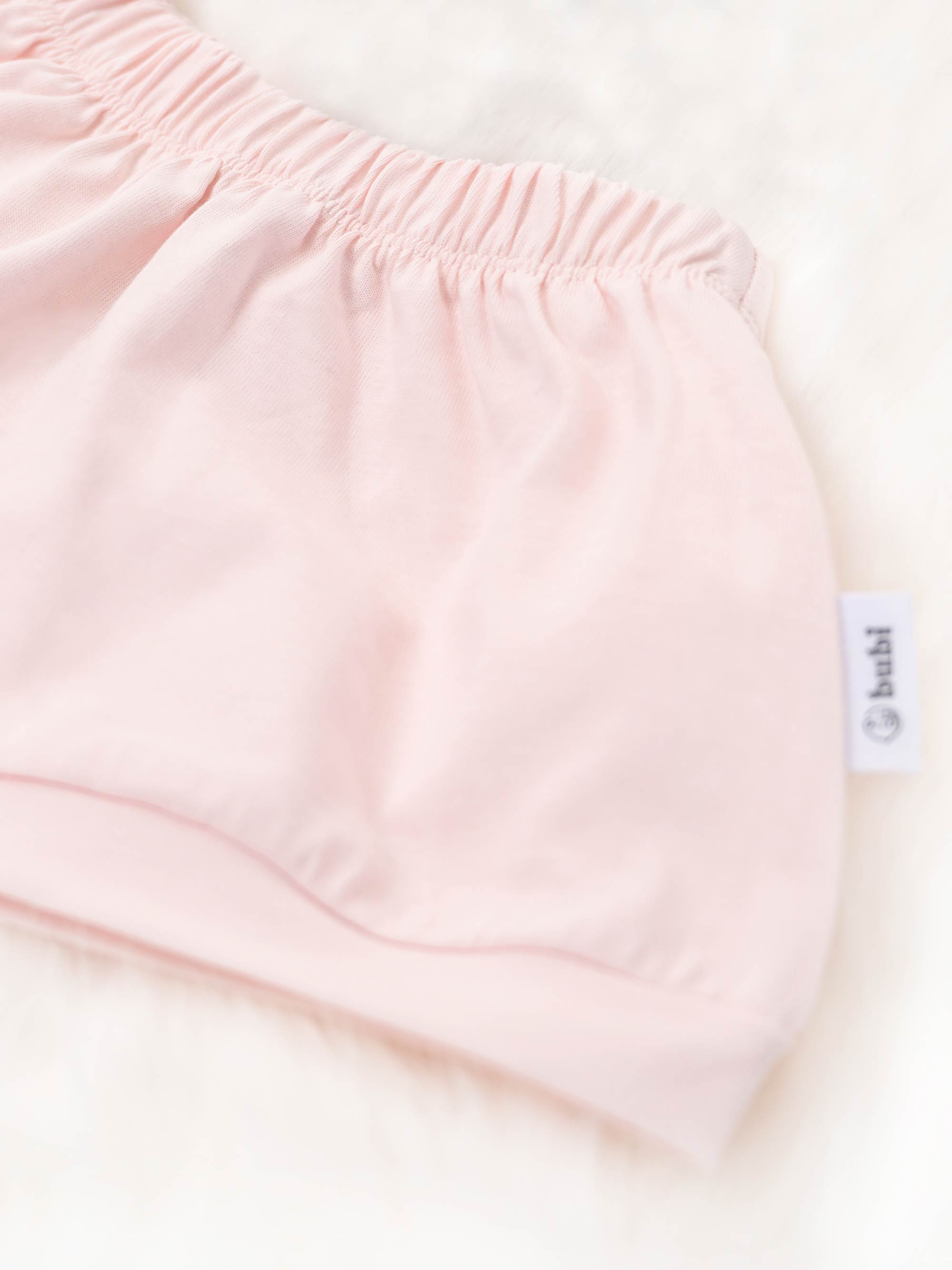 organic cotton baby shorts in pink - side view